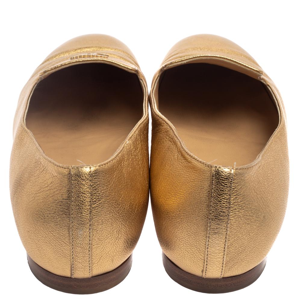 the row gold loafers