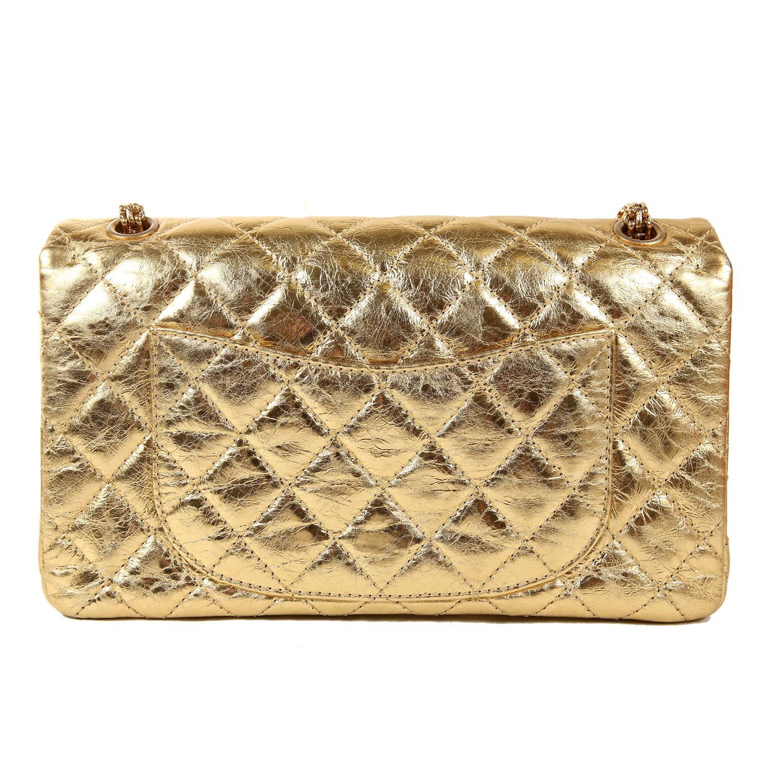 Chanel Metallic Gold Leather Reissue Flap Bag- PRISTINE; appears never carried. 
The updated classic is stunning in show stopping metallic gold foil.
Gold foiled leather is quilted in signature Chanel diamond pattern with an intentionally crinkled