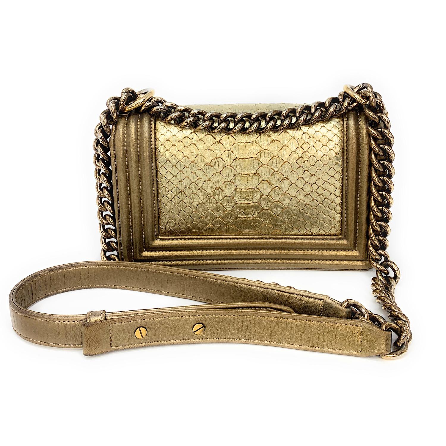 Up for sale; Chanel Metallic Gold Python Small Boy Small Flap Bag with brushed gold-tone hardware, single chain-link and leather shoulder strap, python panel at center exterior, tonal leather lining, single slit pocket at interior wall and push-lock