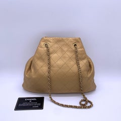 CHANEL Metallic Gold Quilted Calfskin Drawstring Bucket Bag Mini
