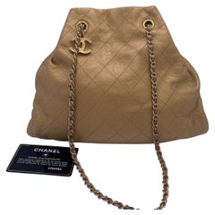 CHANEL Metallic Gold Quilted Calfskin Drawstring Bucket Bag Mini