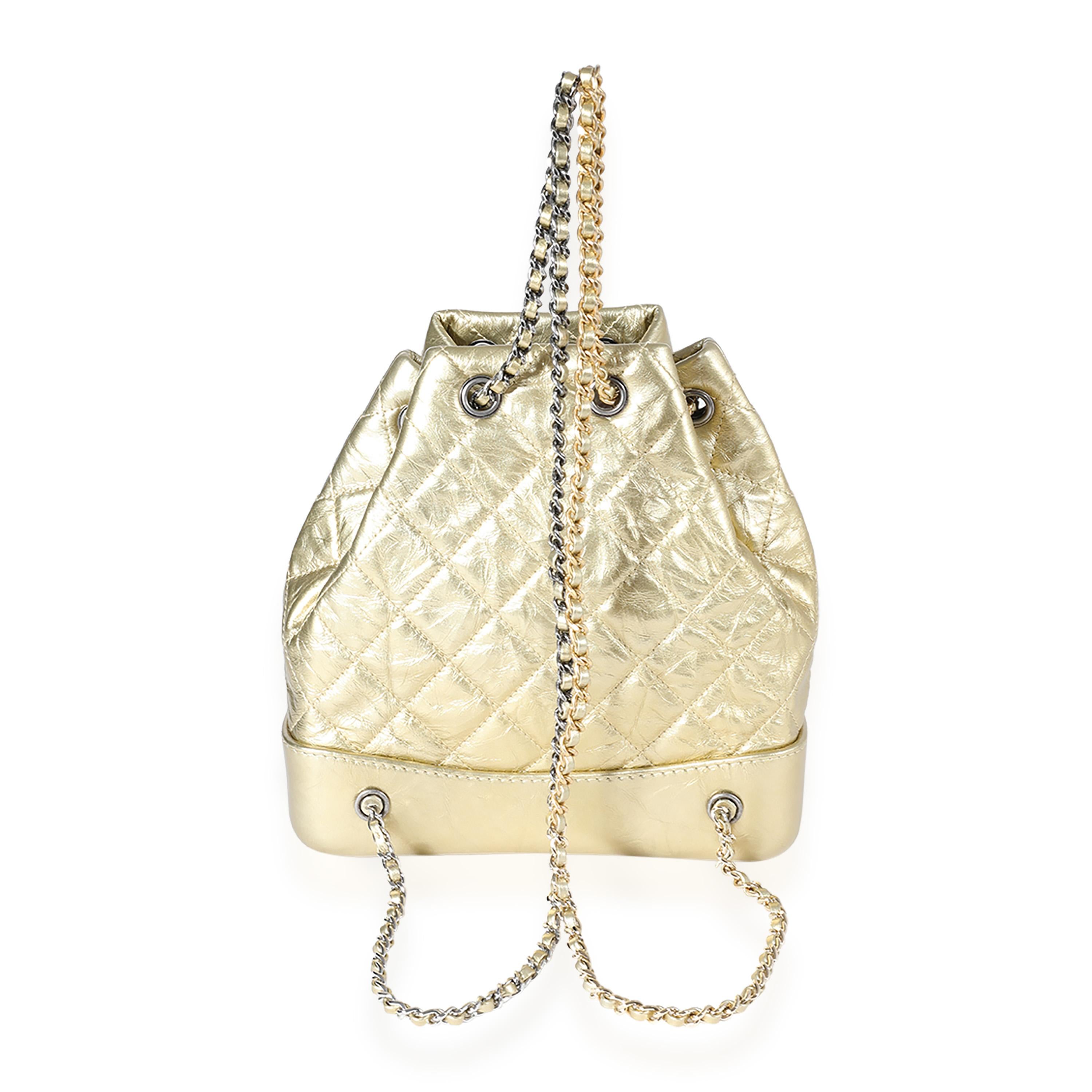 Listing Title: Chanel Metallic Gold Quilted Calfskin Small Gabrielle Backpack
SKU: 123033
Condition: Pre-owned 
Handbag Condition: Excellent
Condition Comments: Excellent Condition. Light scuffing at interior. No other signs of wear.
Brand: