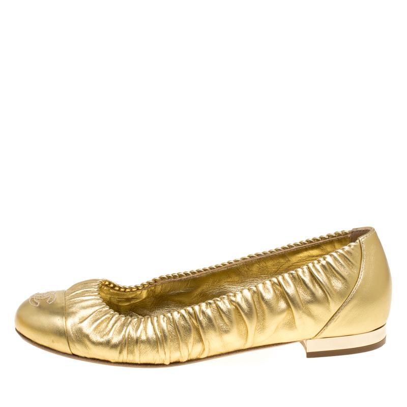 Chanel's golden ballet flats are super-stylish exuding a metallic finish. Crafted from leather and styled with ruched trims on the top line and CC stitch on the cap toes, these flats can be worn with almost anything for a polished finish!

Includes: