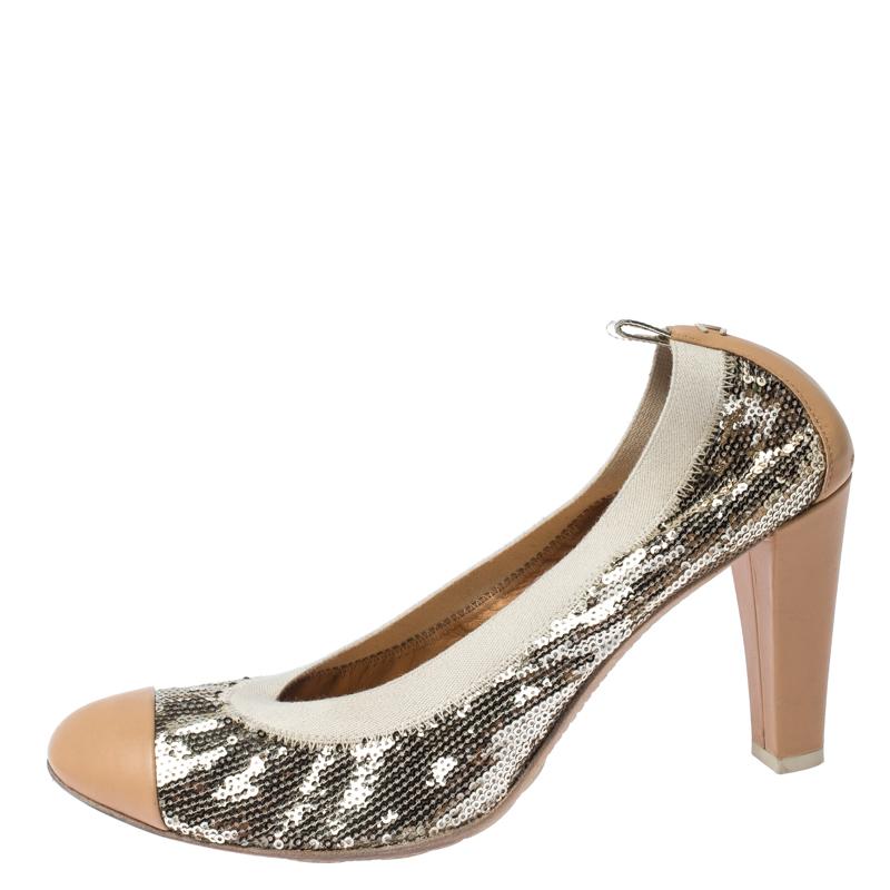 These pumps from Chanel are worth every shilling you spend and will make you stand out in the crowd. The gold pumps are crafted from sequins and feature round leather cap toes. They flaunt comfortable leather-lined insoles, 9cm block heels and pull