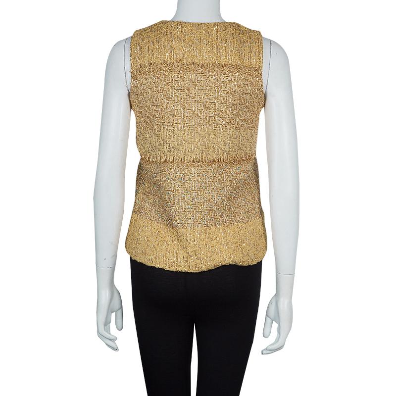 A classy girl would never fail to dress up in this astonishing sleeveless top tailored by Chanel. Crafted with polyester, nylon and silk blend, it features a V shaped neckline along with fringed details.

Includes: The Luxury Closet Packaging

