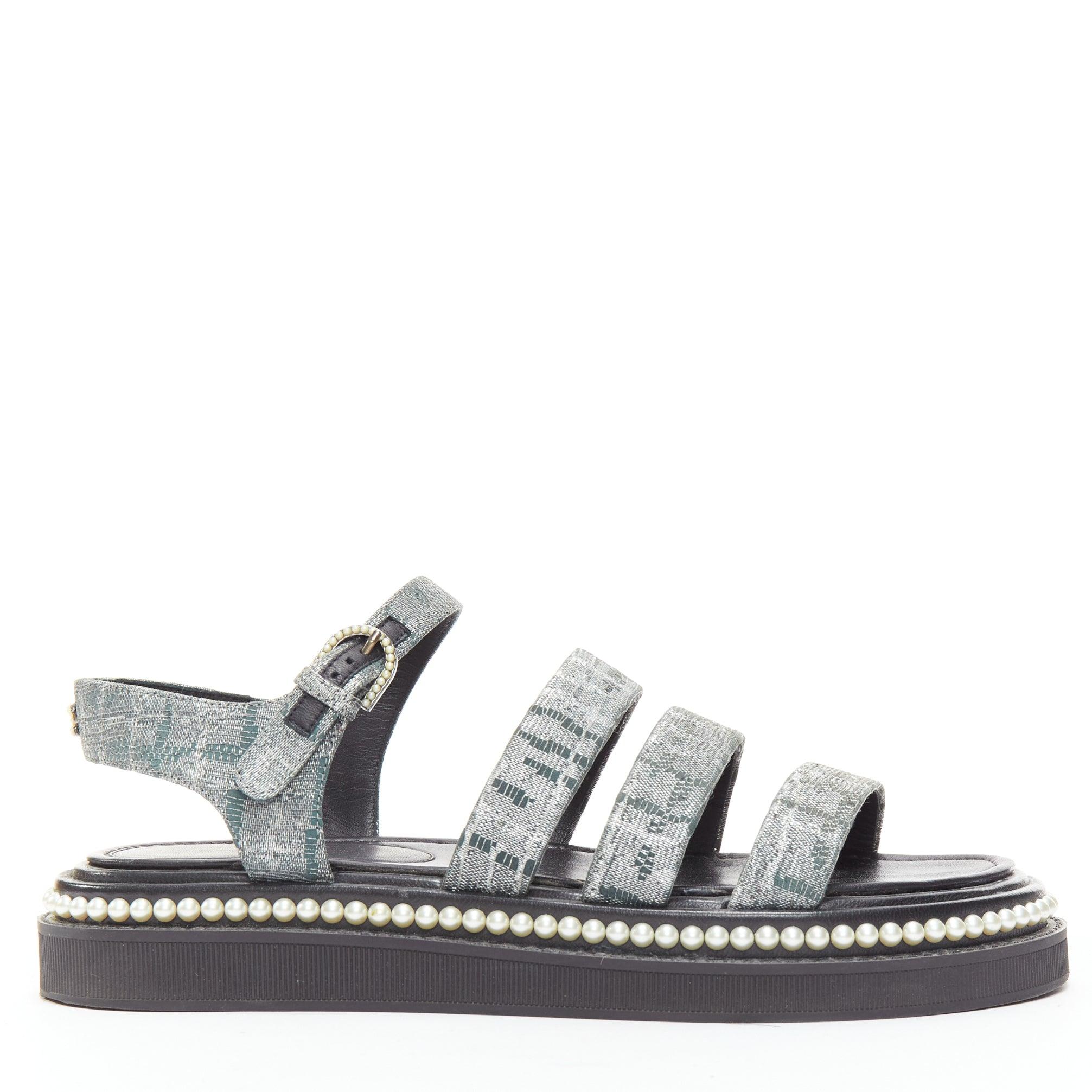 CHANEL metallic grey metallic jacquard pearl embellished dad sandals EU38
Reference: TGAS/D00981
Brand: Chanel
Model: Dad Sandal
Material: Fabric
Color: Grey, Black
Pattern: Solid
Closure: Ankle Strap
Lining: Black Leather
Extra Details: CHANEL