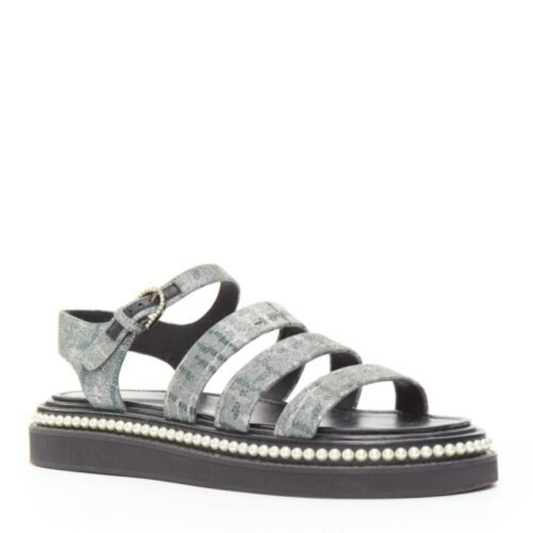 CHANEL metallic grey metallic jacquard pearl embellished dad sandals EU38
Reference: TGAS/D00981
Brand: Chanel
Model: Dad Sandal
Material: Fabric
Color: Grey, Black
Pattern: Solid
Closure: Ankle Strap
Lining: Black Leather
Extra Details: CHANEL