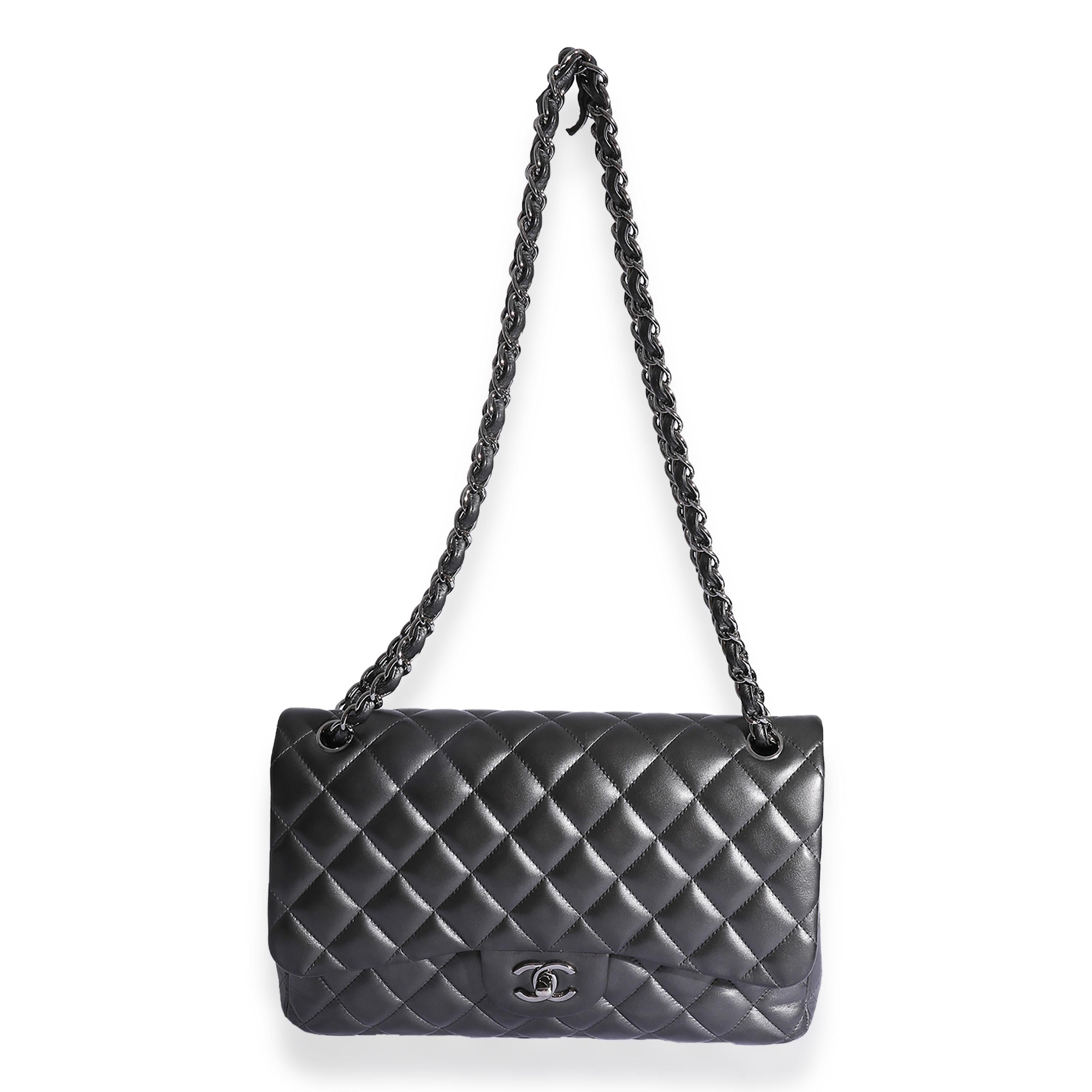 Listing Title: Chanel Metallic Gunmetal Quilted Lambskin Jumbo Double Flap Bag
SKU: 125304
Condition: Pre-owned 
Handbag Condition: Fair
Condition Comments: Fair Condition. Heavy scuffing at corners and throughout exterior. scratching at hardware.