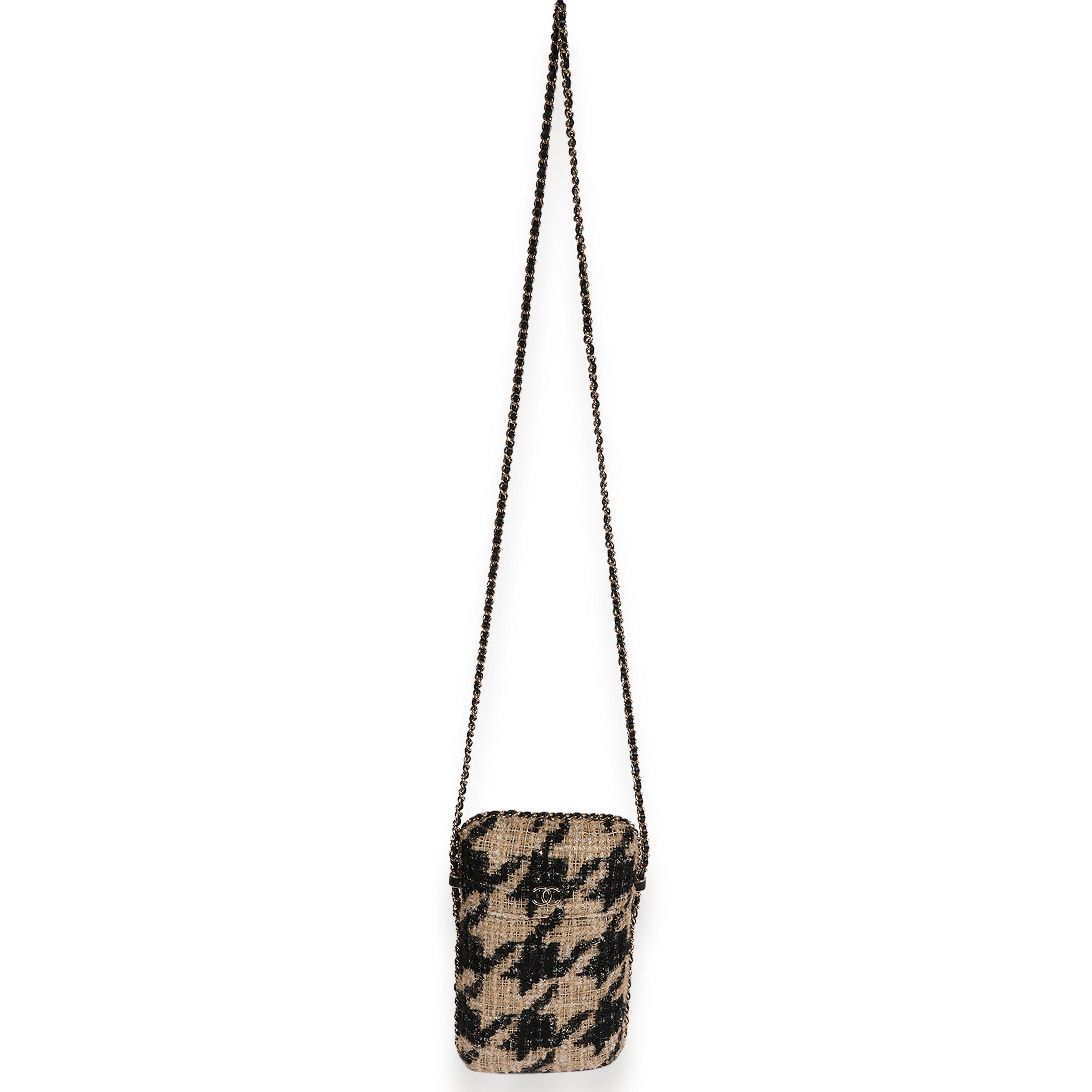 Listing Title: Chanel Metallic Houndstooth Print Tweed Phone Holder Crossbody
SKU: 123009
Condition: Pre-owned 
Handbag Condition: Excellent
Condition Comments: Excellent Condition. Light scuffing at interior. No other signs of wear.
Brand:
