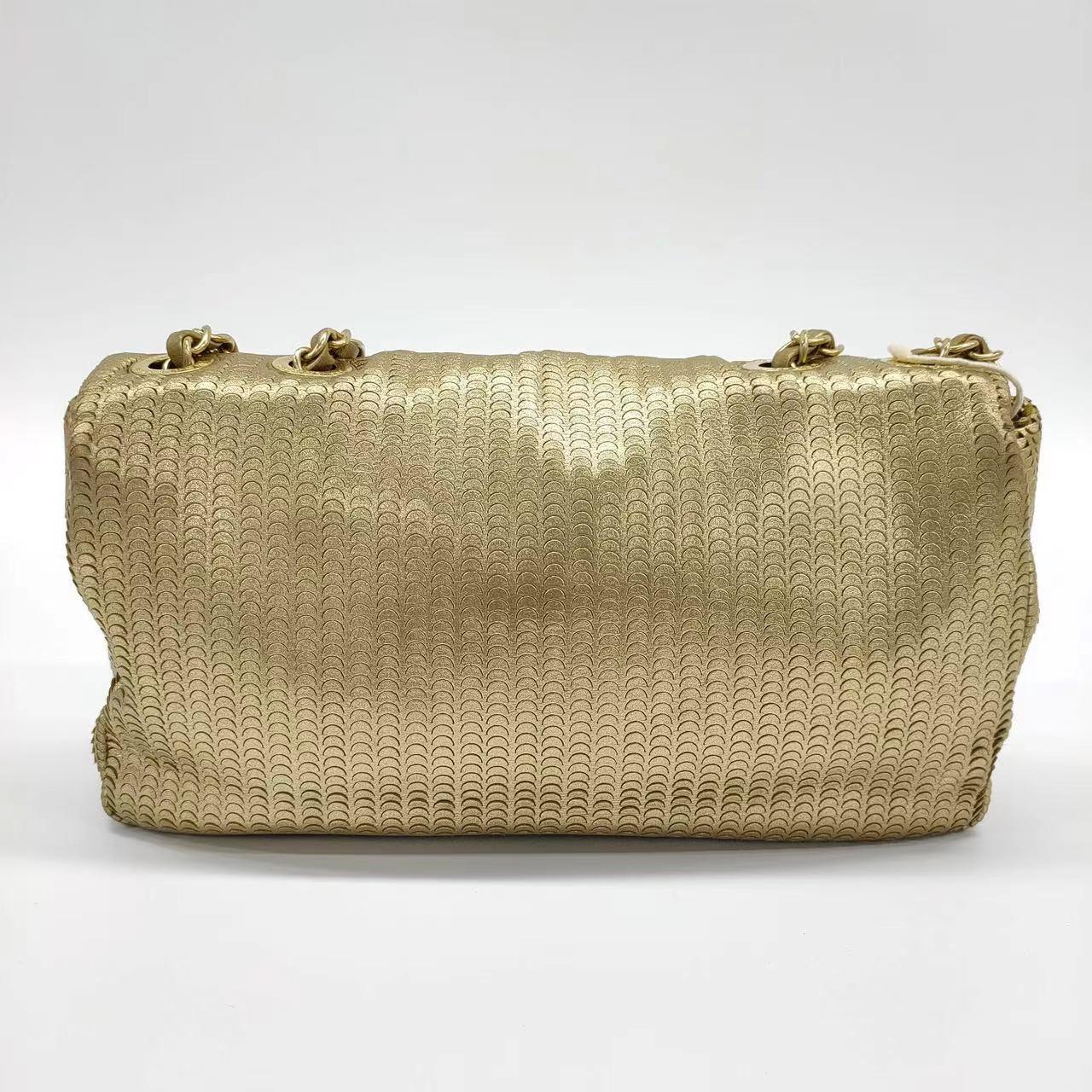 Chanel Metallic Lambskin Laser Cut Medium Gold Classic Flap Bag In Good Condition In AUBERVILLIERS, FR