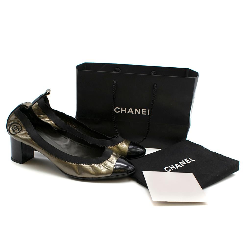 Chanel Metallic Patent Elastic Low Heel Pumps

- Rounded patent black toe
- Patent finish
- Elastic edges for a fitted feel
- Chanel stitched logo on heel

Please note, these items are pre-owned and may show signs of being stored even when unworn
