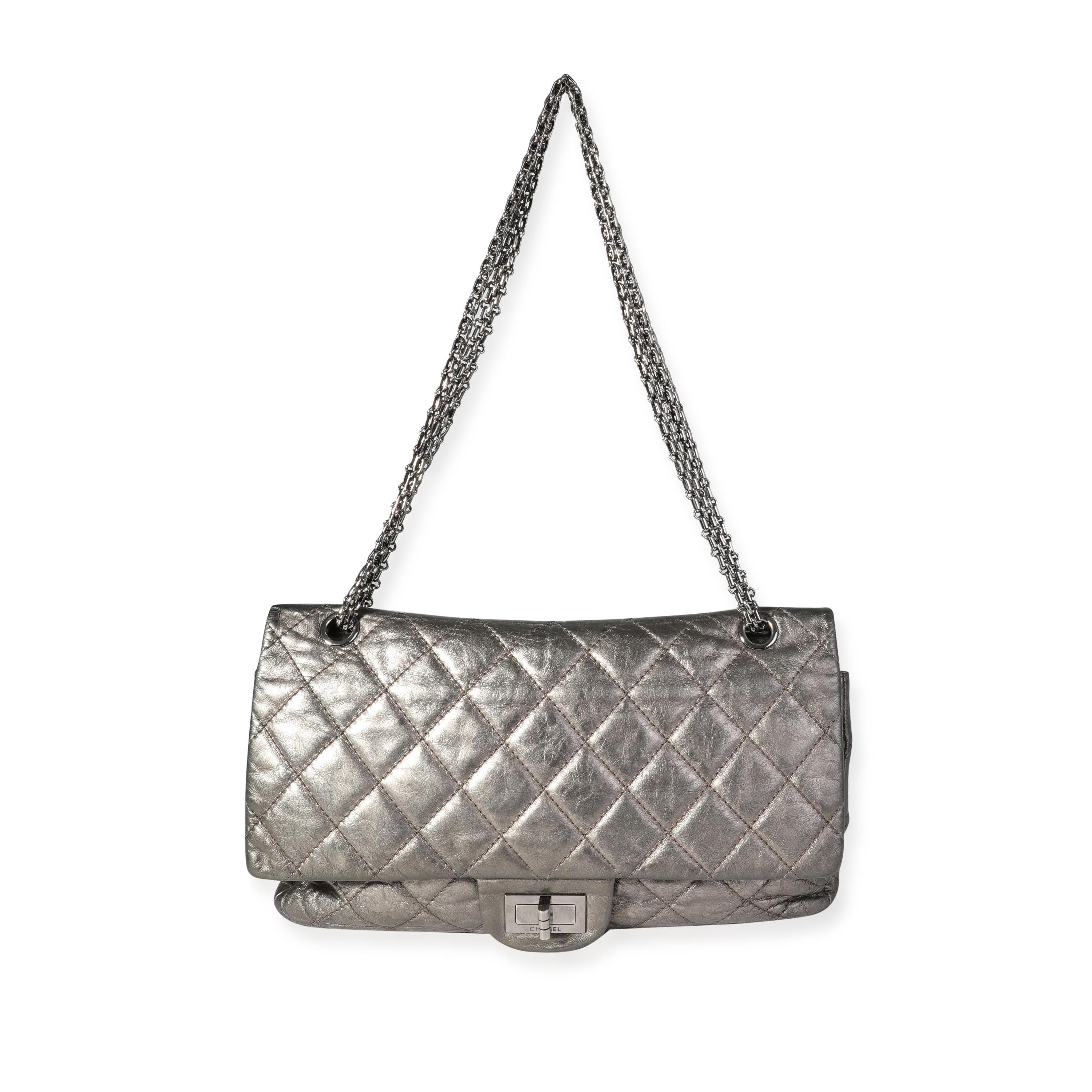 Listing Title: Chanel Metallic Pewter Crinkle Lambskin Reissue 2.25 227 Double Flap Bag
SKU: 118213
MSRP: 10000.00
Condition: Pre-owned (3000)
Handbag Condition: Good
Condition Comments: Good Condition. Crackling to metallic finish. Wear at corners.