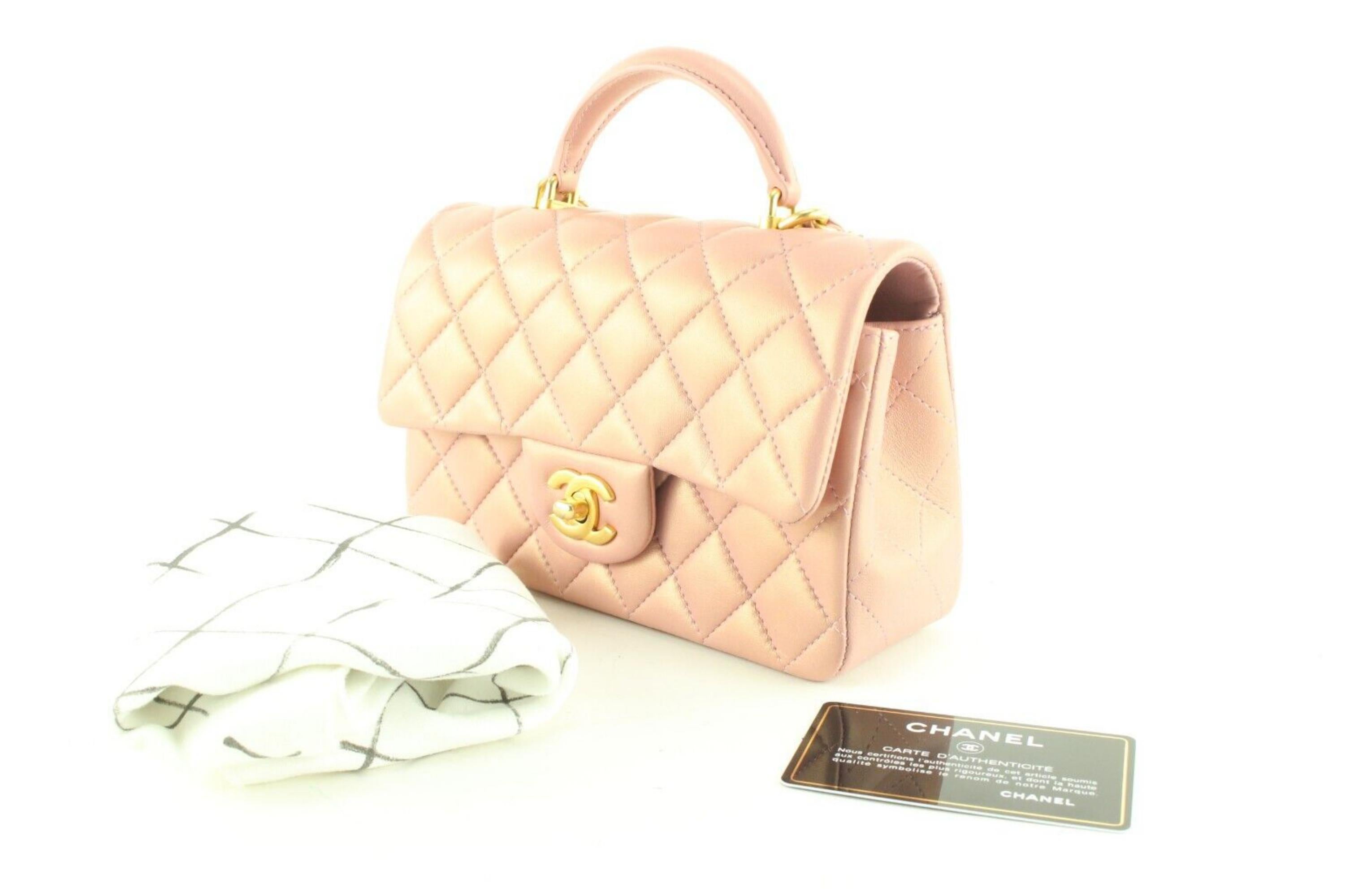 Chanel Metallic Pink Iridescent Mini Top Handle Classic Flap GHW 1CK0418
Date Code/Serial Number: 31335212

Made In: France

Measurements: Length:  7.5