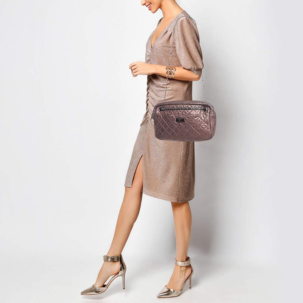 Chanel bags are iconic and noteworthy in the history of fashion. Hence this Reissue 2.55 camera bag is a buy that is worth every bit of your splurge. Exquisitely crafted from metallic leather it bears their signature quilt pattern and the iconic