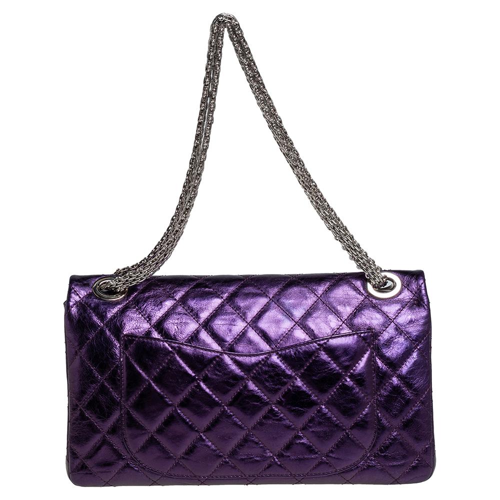 Introduce Chanel's irreplaceable style to your closet with this Reissue 2.55 Classic 228 bag. Crafted using leather, the metallic purple bag has a signature quilted exterior, the Mademoiselle lock on the front, and a leather-lined interior. Complete