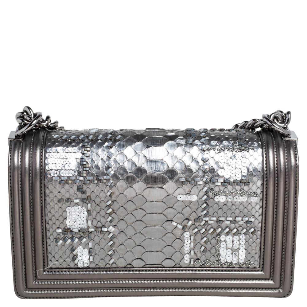 Every Chanel creation deserves to be etched with honor in the history of fashion as they carry irreplaceable style. Like this stunner of a Boy Flap that has been exquisitely crafted from leather and python skin. It does not only bring an embellished