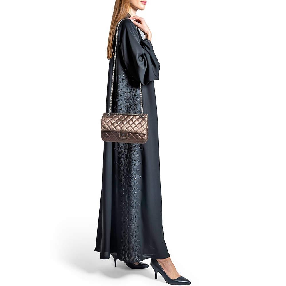 Imbued with traditional details the Reissue 2.55 bag from Chanel is iconic and one of the most admired collections of the brand. The chain shoulder strap of this bag will offer you an easy carrying experience. Made from quilted laminated leather it