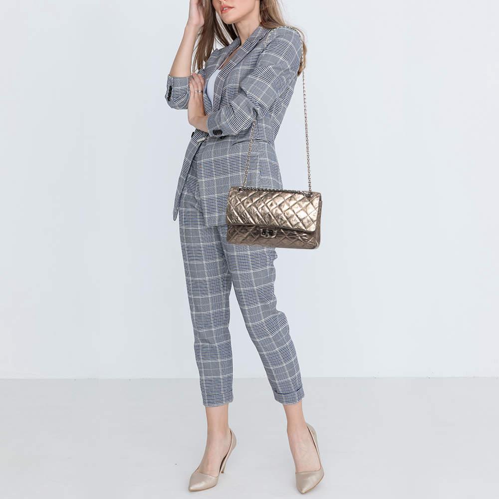 The house of Chanel offers this beautiful Reissue 2.55 Classic 226 Flap bag to help you create timeless style edits every season. Crafted using quilted leather, this piece will last you a long time.

