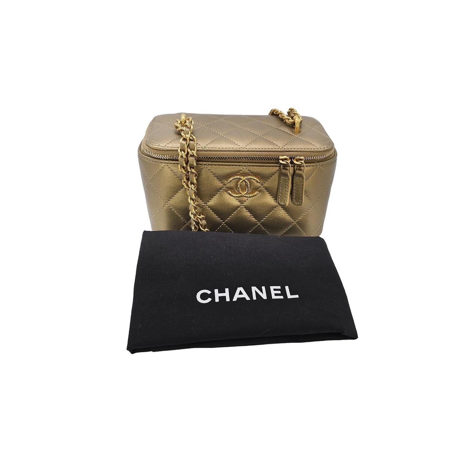 The Chanel Metallic Quilted Lambskin Small Dynasty Vanity Case is an elegant and exclusive piece from the designer brand. Crafted from metallic gold quilted lambskin leather, this vanity case exudes luxury. The dual zipper opens to a gold leather