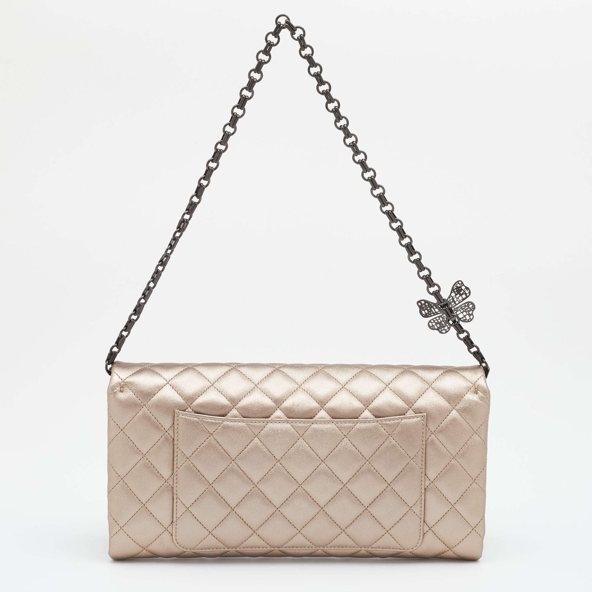 On some days, all one needs is a striking clutch to create a winning look, like this creation from Chanel. It has a pretty design with an exterior covered in metallic quilted leather and a CC-detailed flap revealing enough space to carry your party