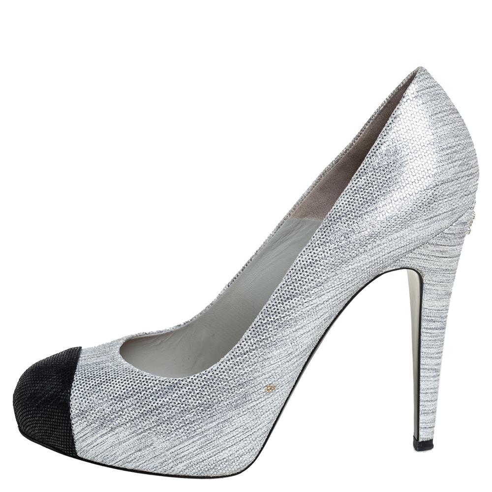 Classy and very stylish, these metallic silver pumps from Chanel are a worthy investment! They are crafted from suede and feature black cap toes, concealed platforms, comfortable leather-lined insoles, and the iconic CC logo detailed 12.5 cm heels.