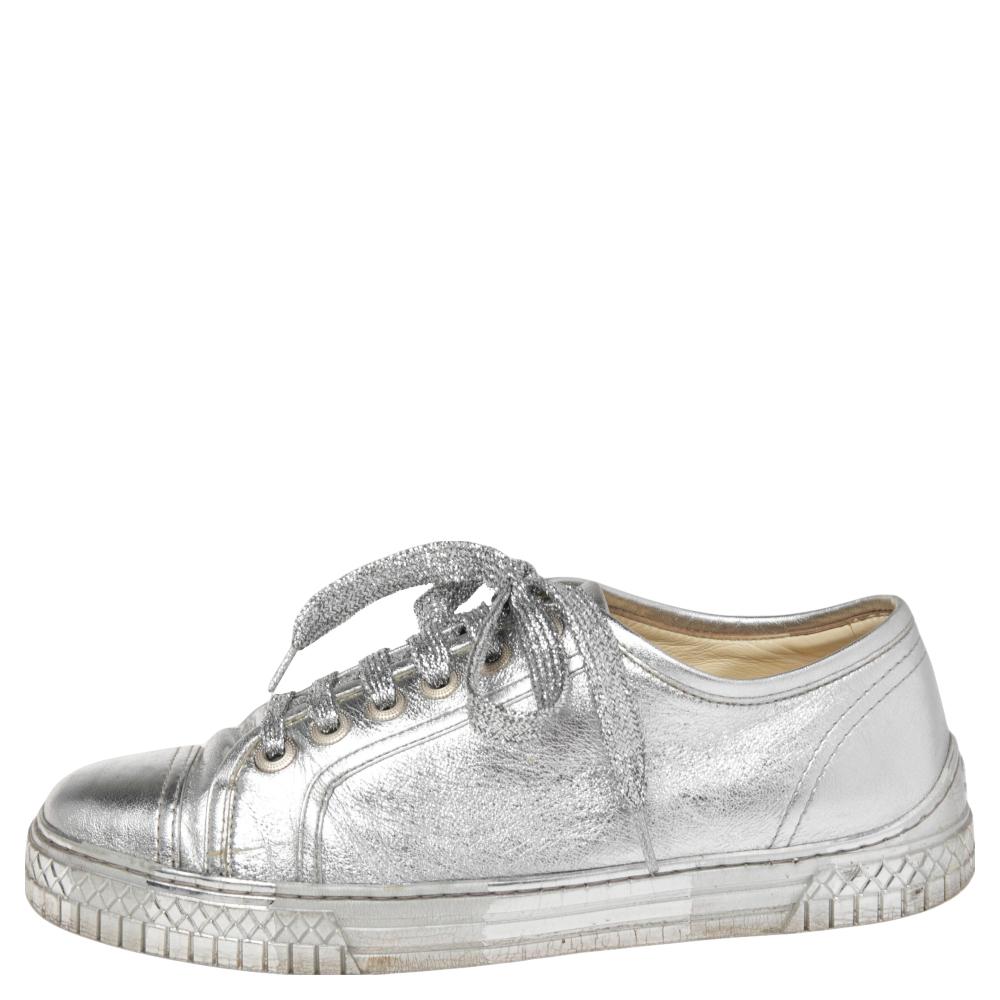 This unique pair of leather sneakers from Chanel is all you need to bring out your style. They come featuring round toes, lace-up on the vamps, tire accents on the midsoles, and rubber soles. The metallic silver sneakers will offer you the right