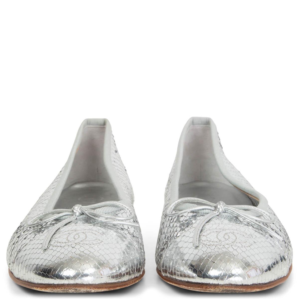 100% authentic Chanel classic ballet flats in silver python embellished with bow detail. Have been worn and are in excellent condition. Come with dust bag.

Measurements
Imprinted Size	39
Shoe Size	39
Inside Sole	25.5cm (9.9in)
Width	8cm