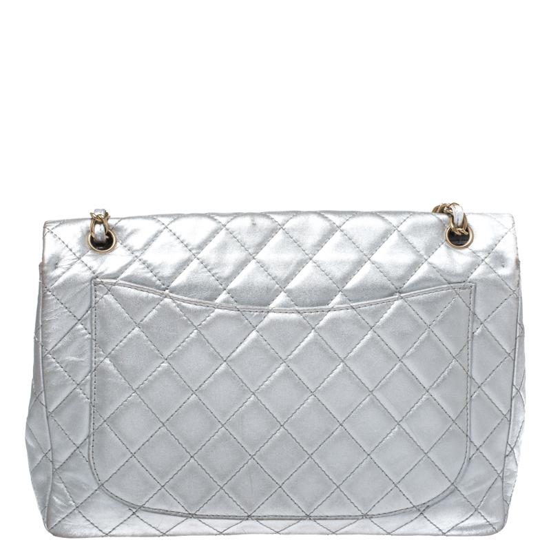 We are in utter awe of this flap bag from Chanel as it is appealing in a surreal way. Exquisitely crafted from metallic silver leather in their quilt design, it bears their signature label on the leather interior and the iconic CC turn-lock on the