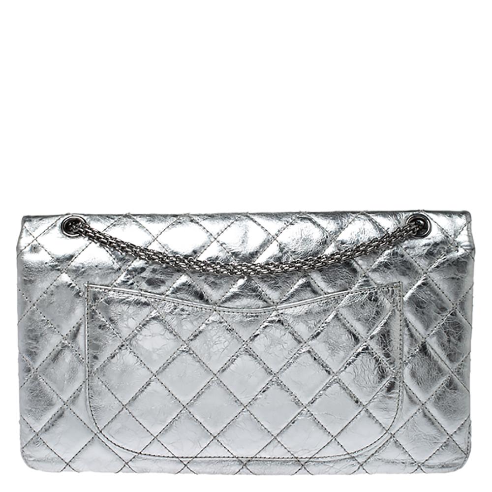Chanel's Flap Bags are iconic and noteworthy in the history of fashion. This Reissue 2.55 is a buy that is worth every bit of your splurge. Exquisitely crafted from metallic silver leather, it bears their signature quilt pattern and the iconic