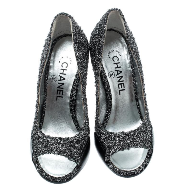 In a magical blend of luxury and elegance, these pumps come crafted from metallic silver textured fabric and leather. They feature peep toes, the CC logos, and 11 cm heels. The pumps are excellently made to offer you the best experience.

Includes: