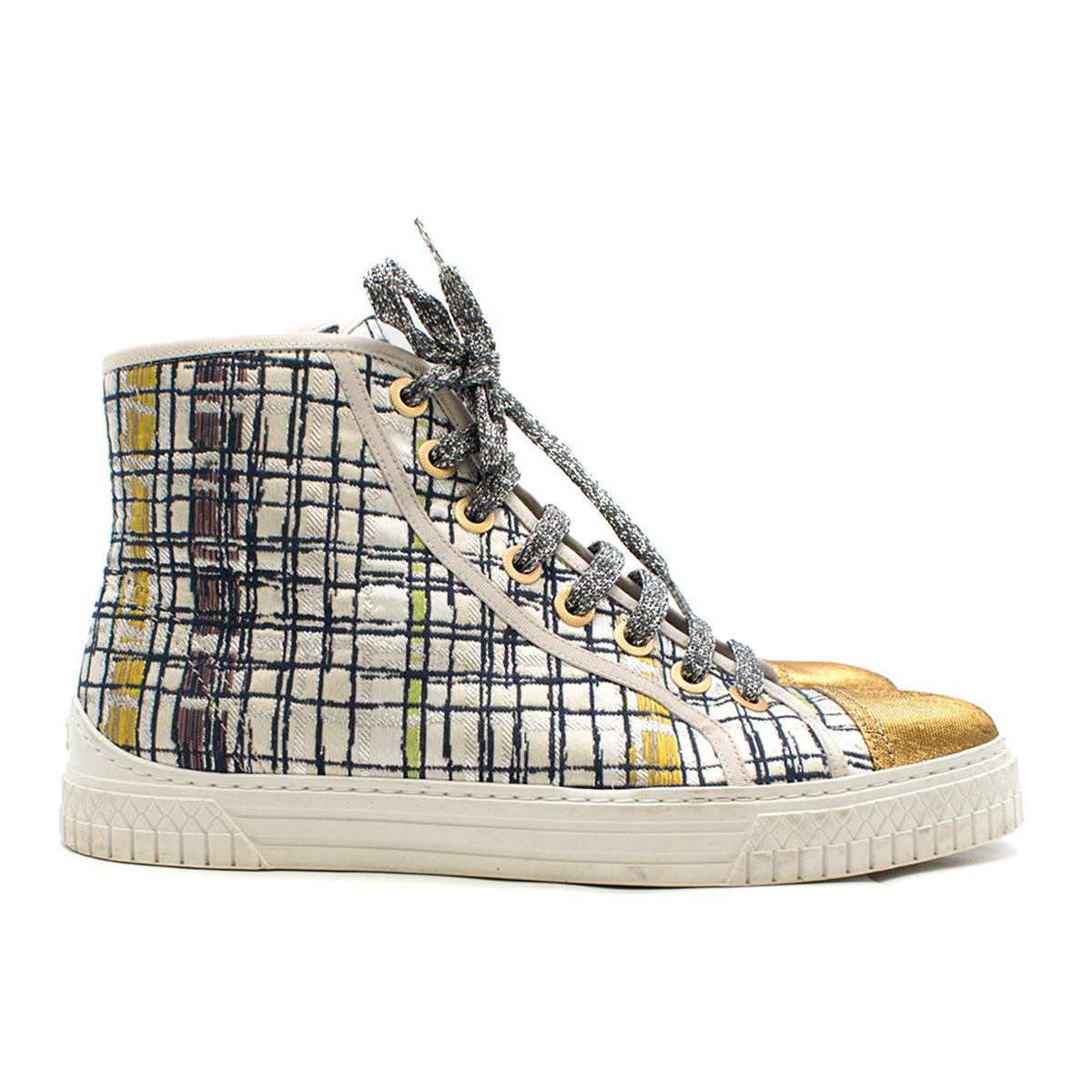 Chanel Metallic Tweed High-Top Sneakers

- Multi-coloured metallic tweed high top sneakers
- Shiny gold toe cap
- Shimmery silver front lace up
- Geometric pattern
- CC logo at the back
- 'Chanel' embroidered on the sides
- White leather lining with