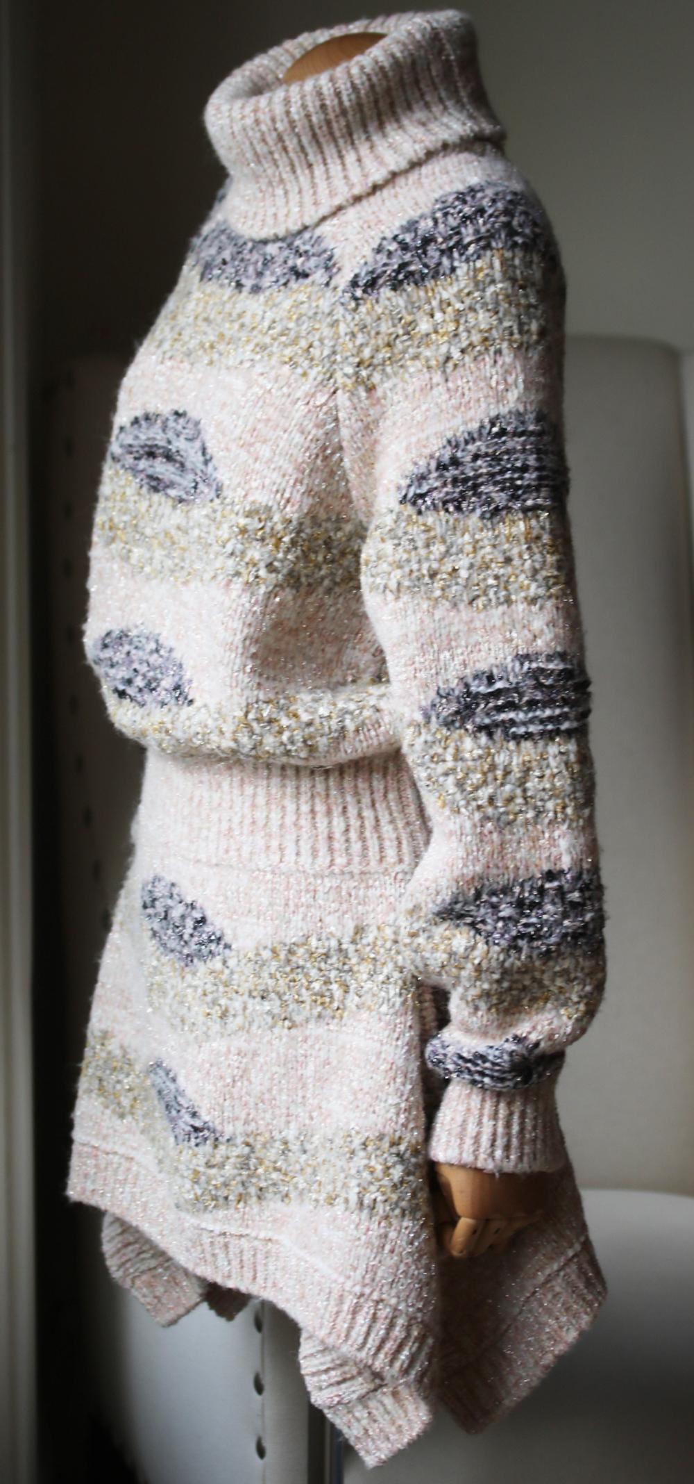 Chanel striped metallic knit wool-blend turtleneck mini dress. Square-cut skirt. Slip on. Ribbed cuffs and trim. Turtleneck neckline. Colour: light pink, tonal blue and tonal golds. 46% Viscose, 24% polyamide, 14% wool, 8% polyester metal, 8%
