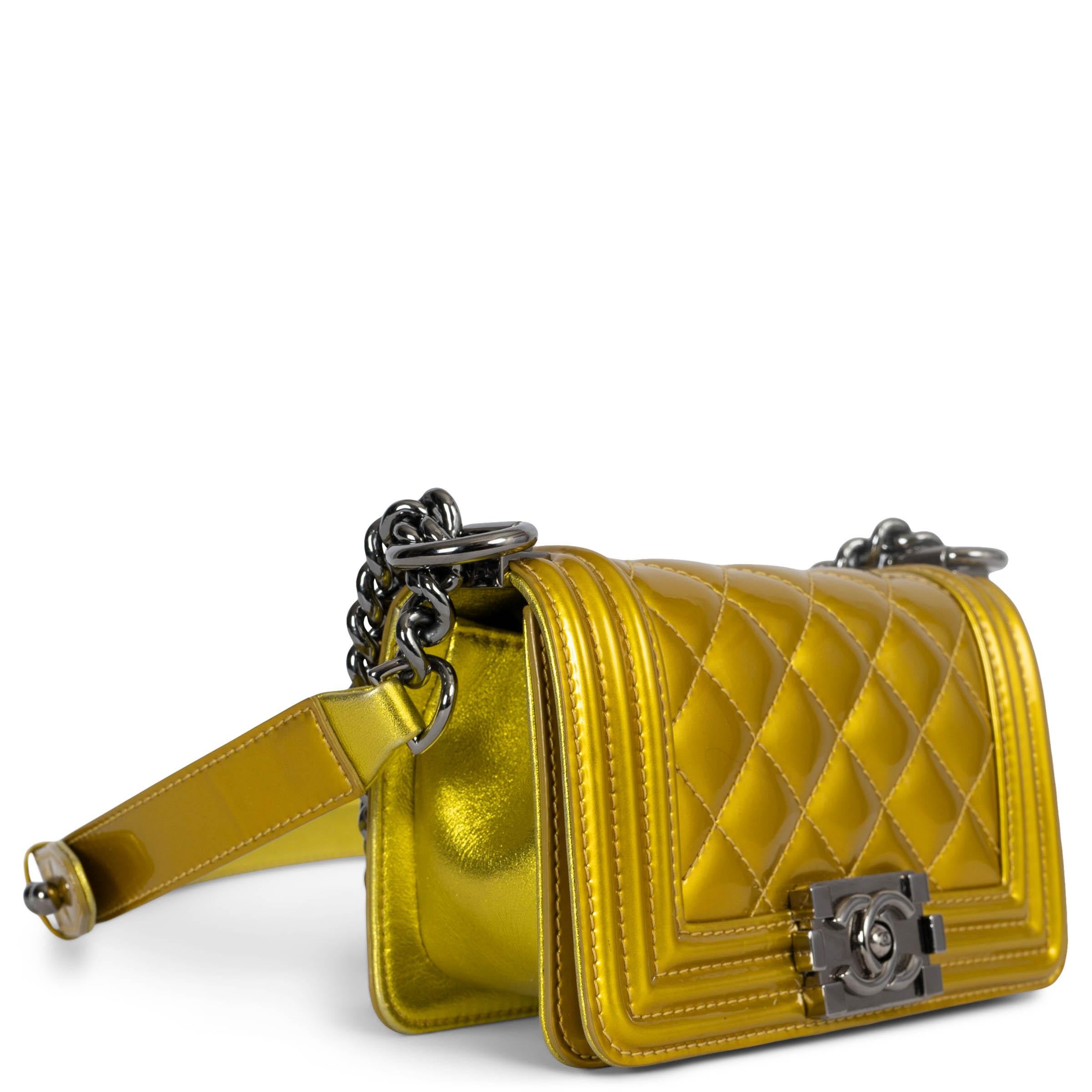 100% authentic Chanel Mini Boy shoulder bag in metallic yellow quilted patent leather featuring mat shiny ruthenium hardware. Lined in black grosgrain with an open pocket against the back. Has been carried and is in excellent condition. Comes with