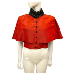 Chanel métiers d’art Paris Shanghai Pre Fall 2010 red silk cape vest by Karl