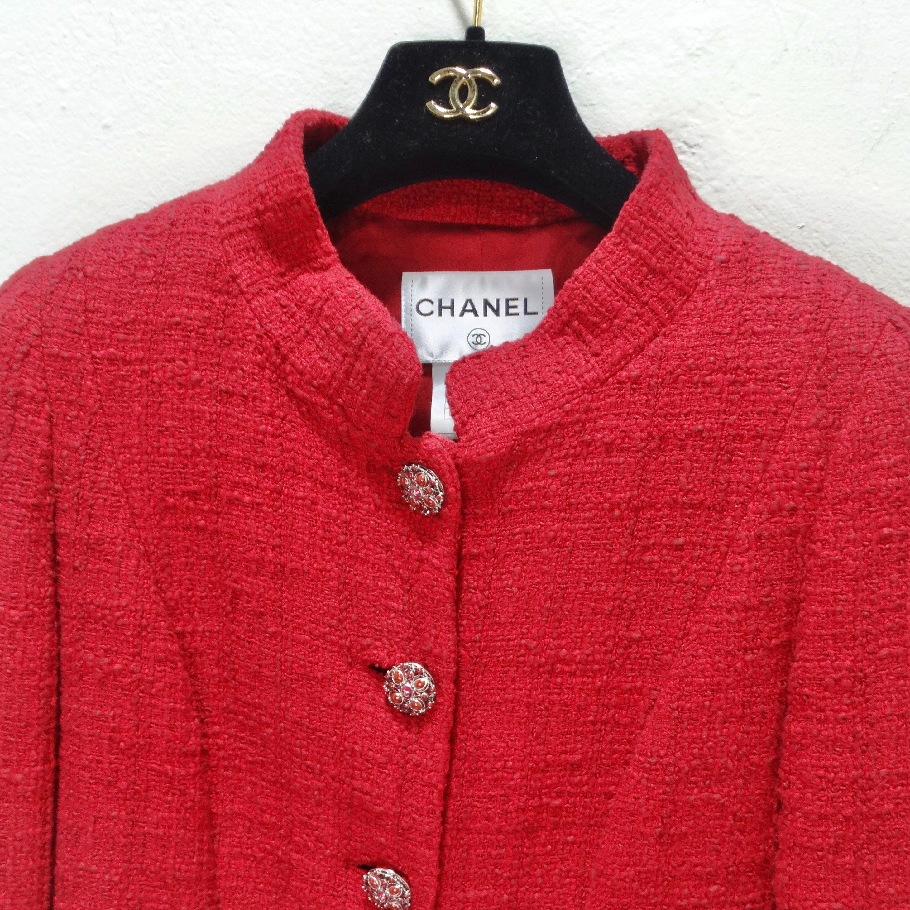 Elevate your fashion game with the epitome of timeless elegance - the Chanel Métiers d'Art Red Tweed Jacket Blazer. This iconic Chanel jacket is more than a garment; it's a masterpiece of haute couture. Crafted from the finest Maison Lesage red