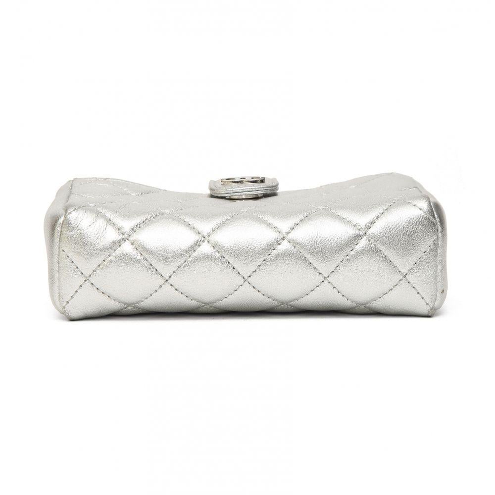 Chanel micro  silver calf leather shoulder bag

Silver leather shoulder bag embellished with silver hardware and a grey faux pearls shoulder strap.
Can be worn as a shoulder bag or a crossbody bag
Measurements
Depth: 4 cm

