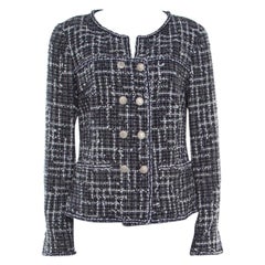 whose creation is the iconic boxy suit in tweed with braid trims Chanel Midnight Blue Tweed Double Breasted Jacket M
