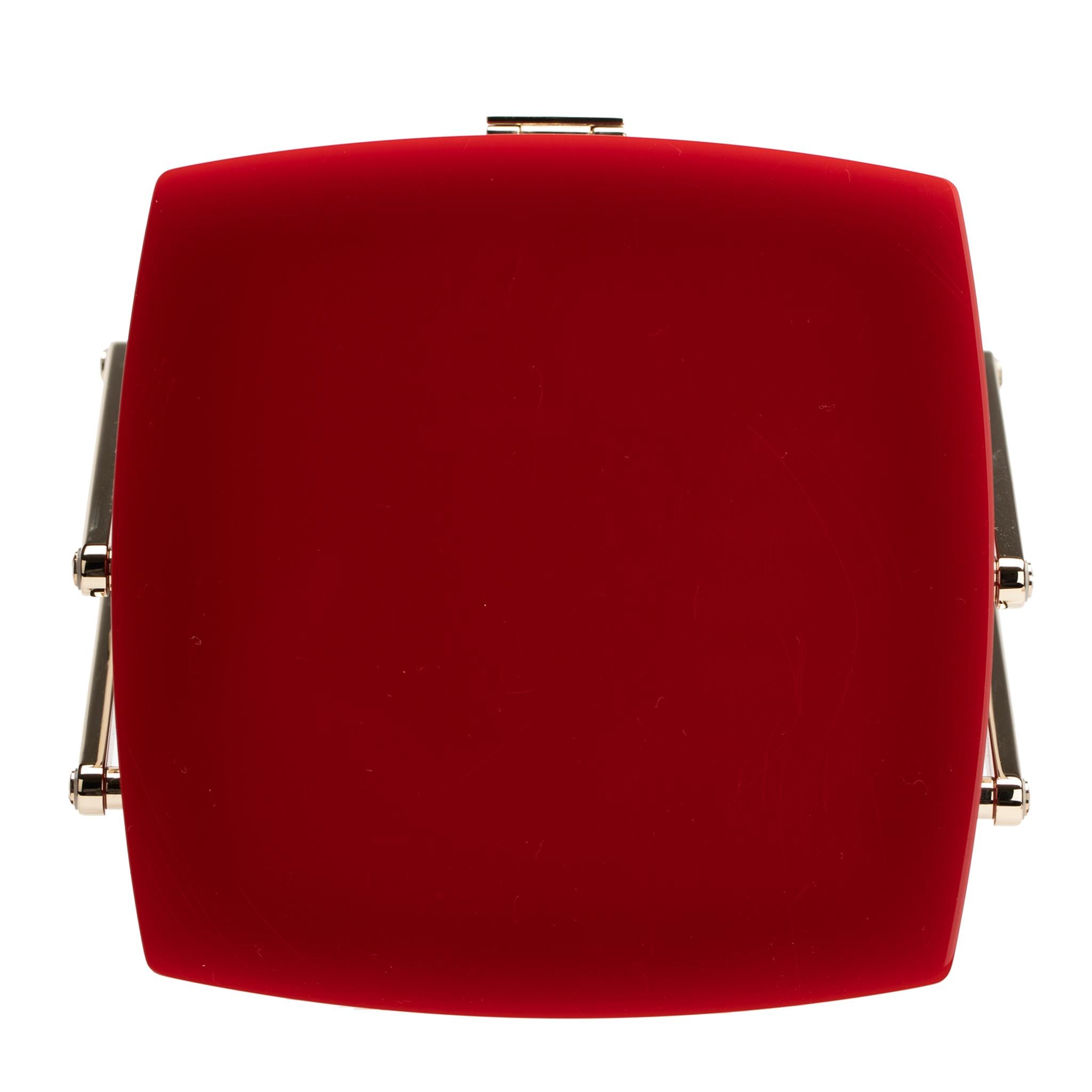 This stunning vanity case takes inspiration for Chanel’s classic leather vanity cases. Skilfully designed in a rich red lucite, complemented by light gold-tone hardware, this limited edition vanity case opens to reveal a mirror and a two-tier