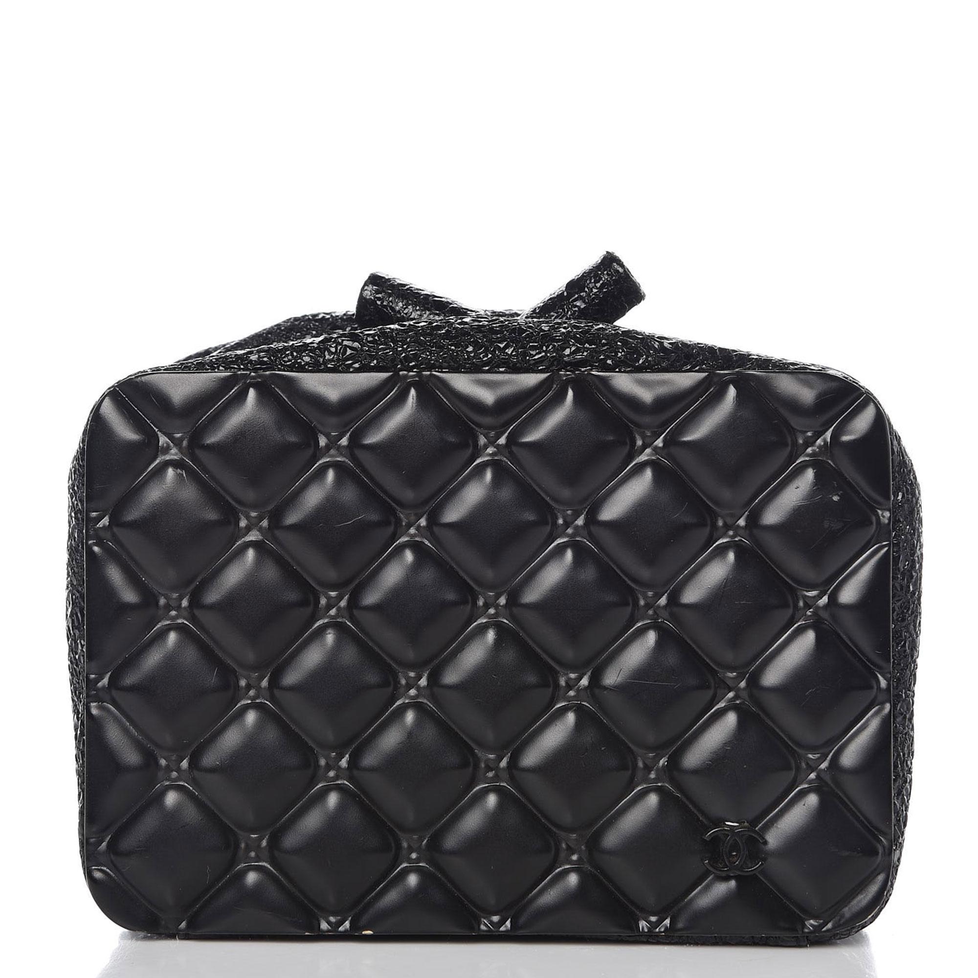 Chanel Minaudière Moscow Leo Runway Rare So Black Charcoal Grey Metal Clutch

Metal in a quilted pattern
Crinkled patent leather
Toggles that open like a change pocket 
Satin all black interior
Featuring a stone encrusted lion's head with the