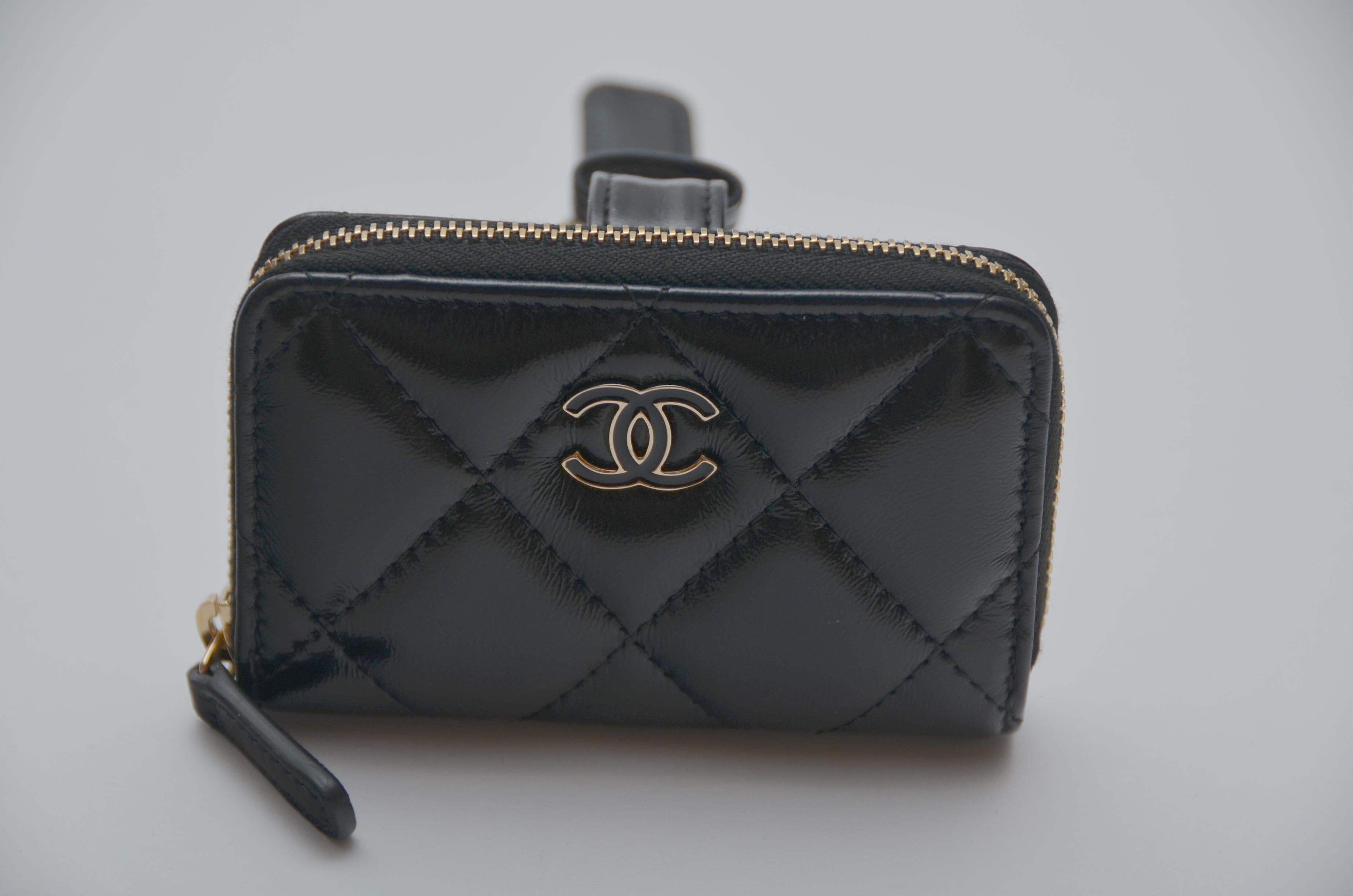 100% authentic guaranteed CHANEL MINI Flap  Purse Wristlet Bracelet  
Shiny Black Leather  
NEW with card, tags ,clear plastic on, Chanel  box and dust-bag.
Receipt available to buyer on request

Final Sale
