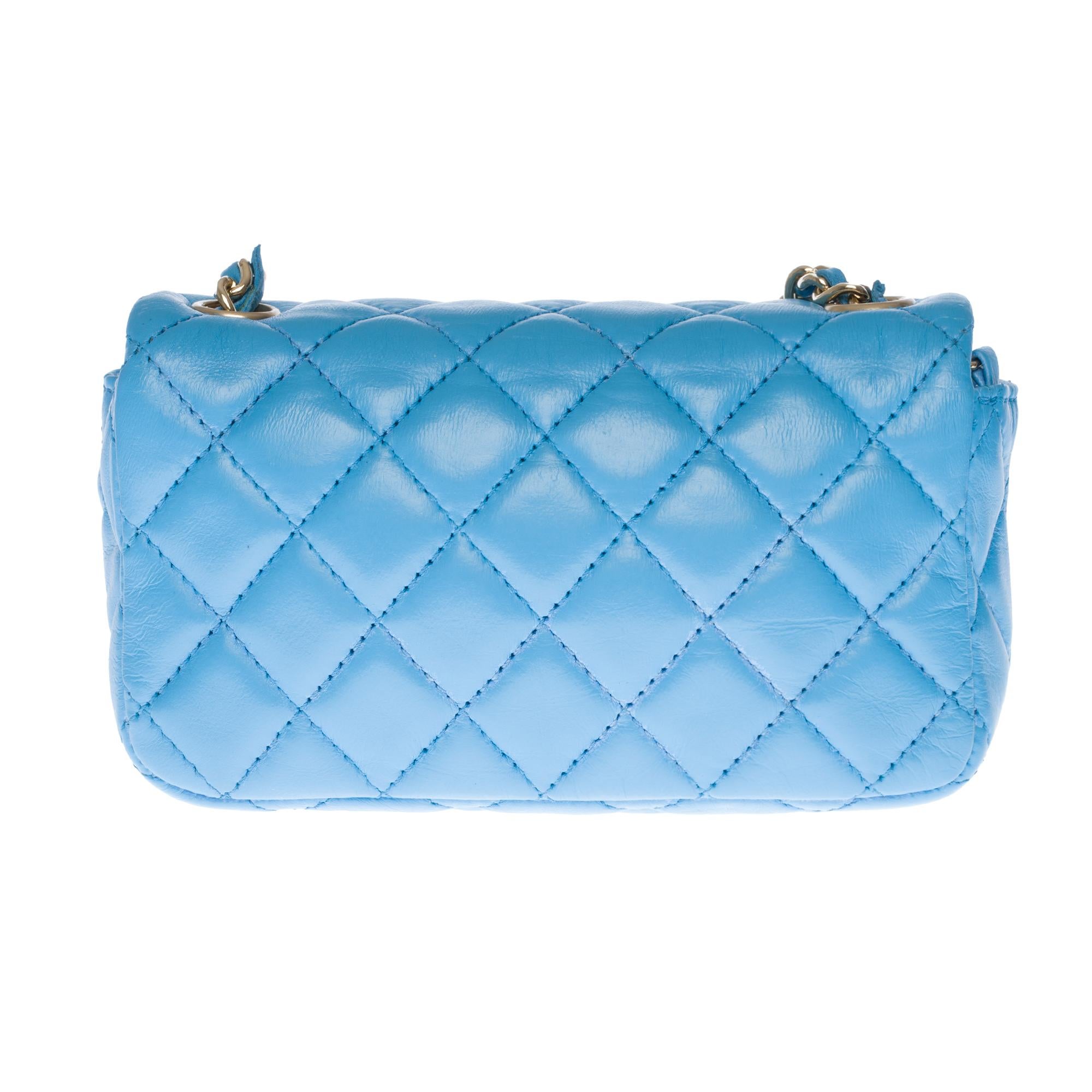 Gorgeous and very sought after Chanel Valentine Mini Charms Flap bag in blue turquoise quilted leather, silver metal shoulder strap handle decorated with heart-patterned charms (Valentine charms) intertwined with blue leather for a shoulder or