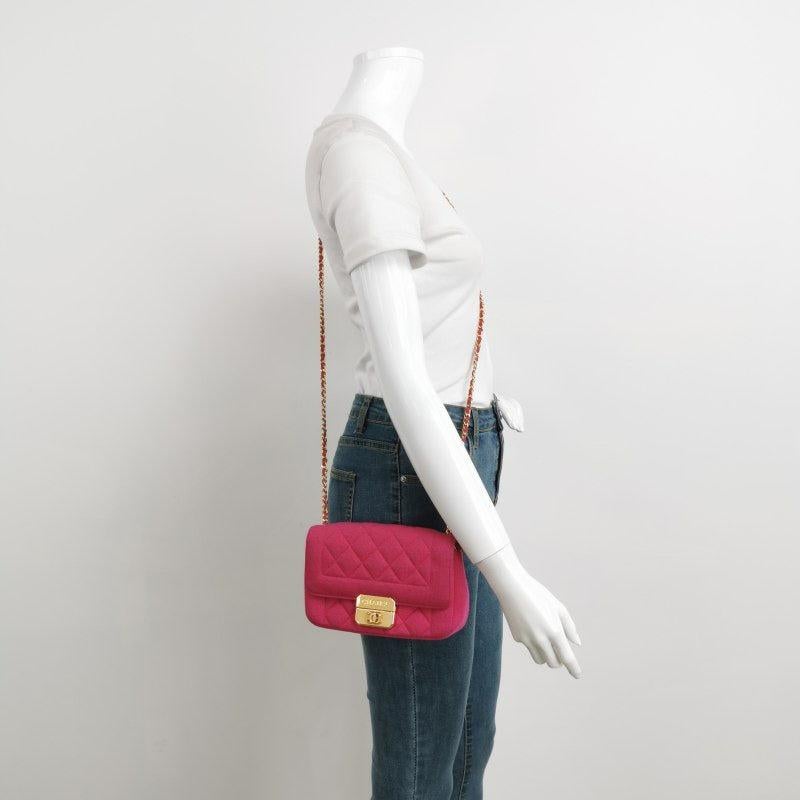 Chanel Mini Chic With Me Flap Bag Cotton Cloth Pink Fuchsia Crossbody Bag

  CONDITION: EXCELLENT 
  Light rubbing around the edges. Hardware shows some scratches. Interior clean. 
  DETAILS
  
  Circa 2014-2015
  Chanel
  
  Color: Pink
  Material: