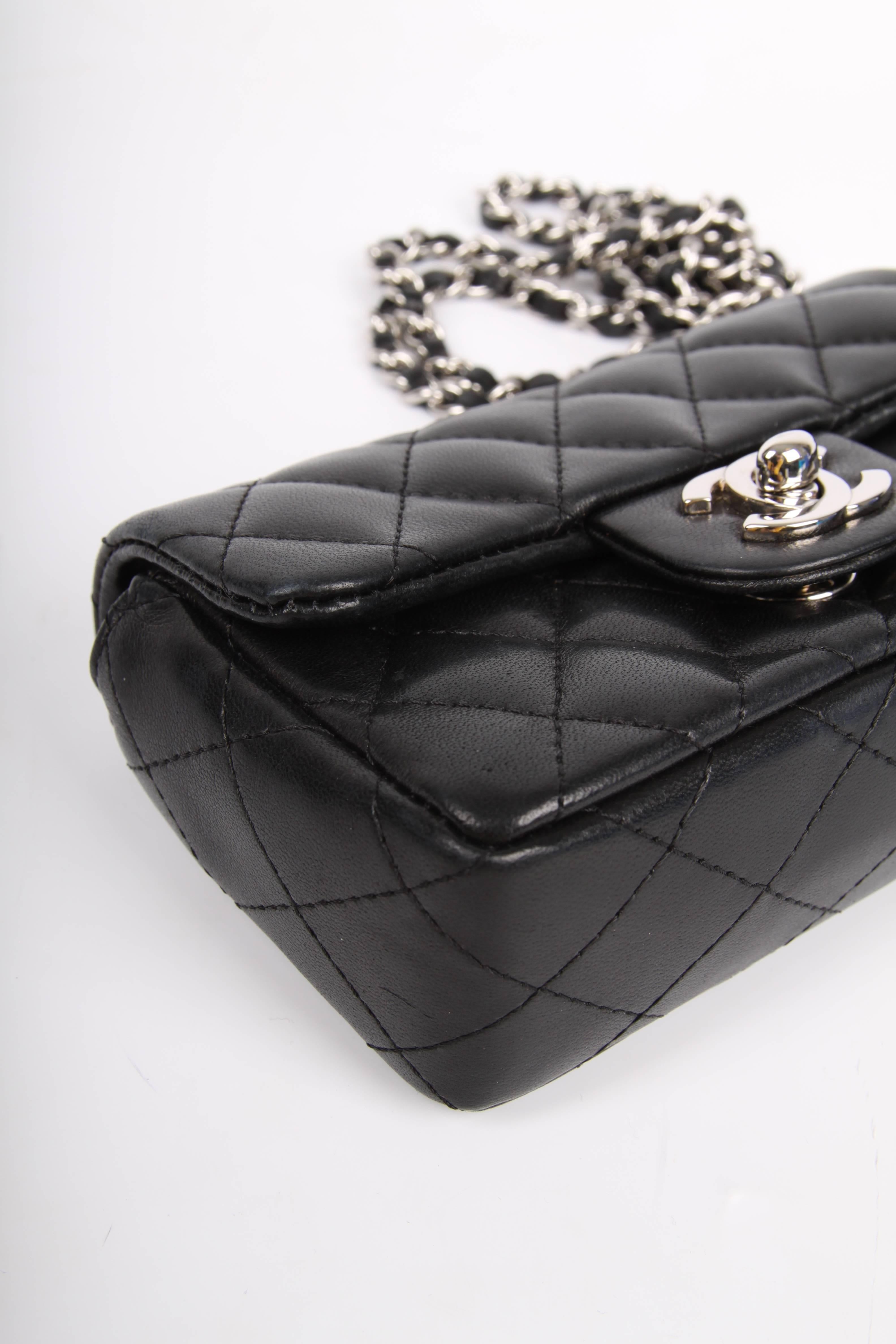 As sweet as candy! Micro Chanel bag in black leather. 

Magnificent bag, the leather is fully quilted. Silver-tone turnlock CC closure at the front and a silver-tone chain that measures 122 centimeters and is entwined with black leather. Long enough