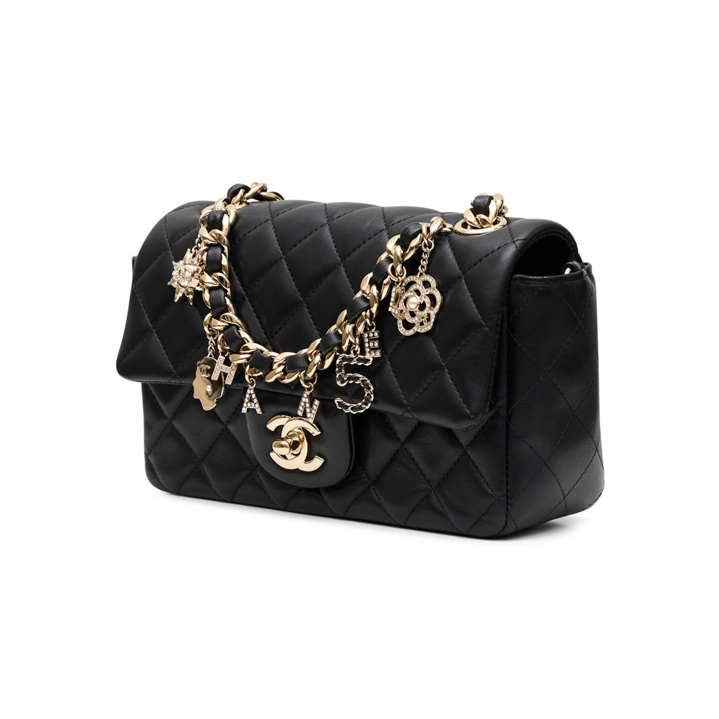 *Mini flap bag
*Black
*Lambskin leather
*Gold-tone hardware
*Charm detailing with Coco Chanel motifs
*Diamond quilting
*Signature interlocking CC logo
*Turn-lock fastening
*Main compartment
*Leather and chain-link shoulder strap
*Leather