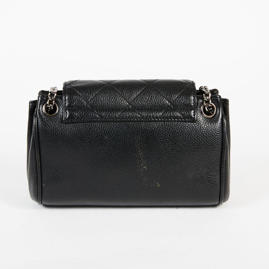 Women's CHANEL Mini Flap Bag in Black Caviar Leather