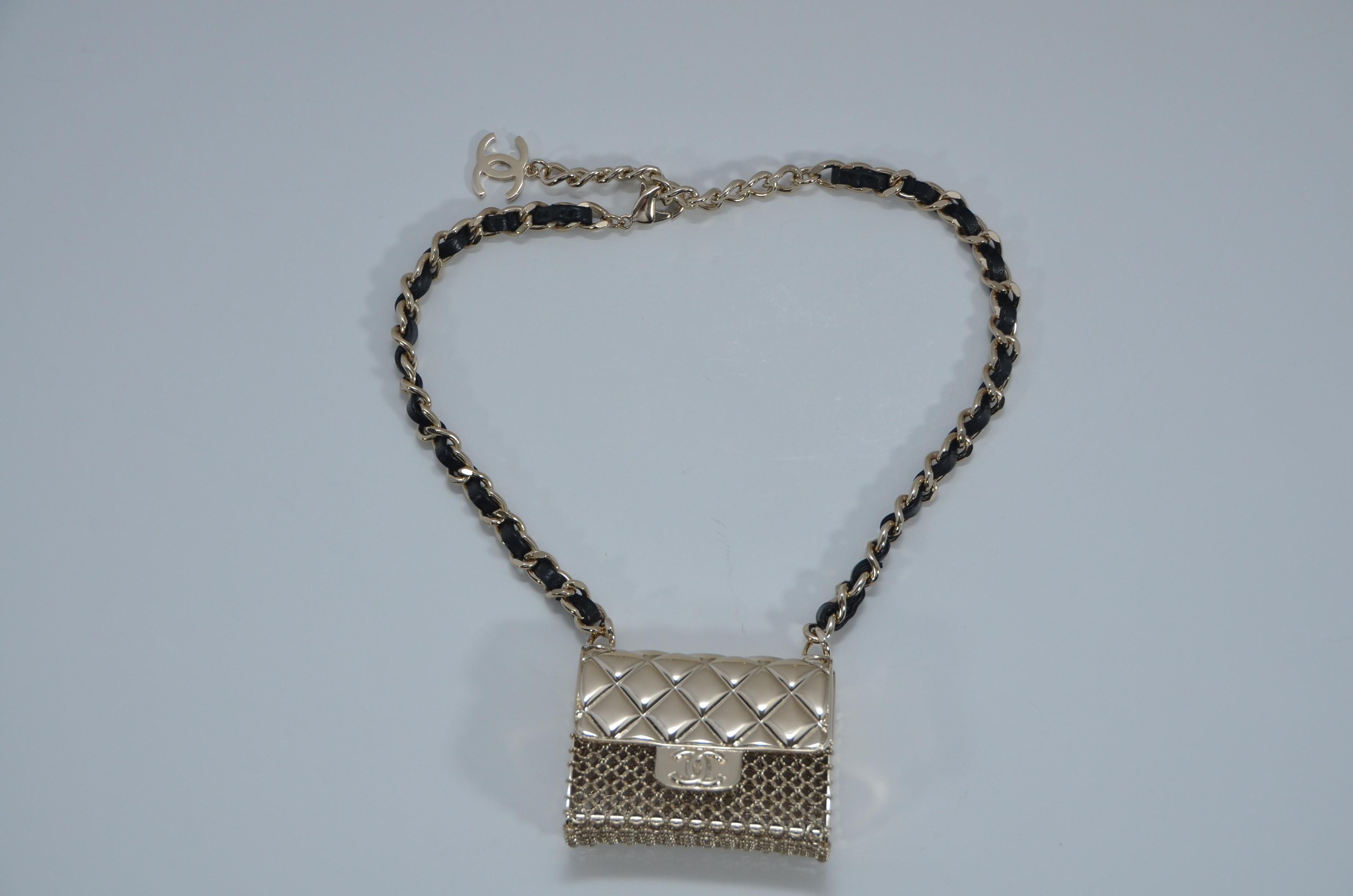 100% AUTHENTIC Chanel mini handbag necklace 
Original receipt with personal info covered will be sent upon request .
Gold tone metal hardware with lambskin woven leather 
Mini purse is  chunky  functional and can be opened 
New with tags and