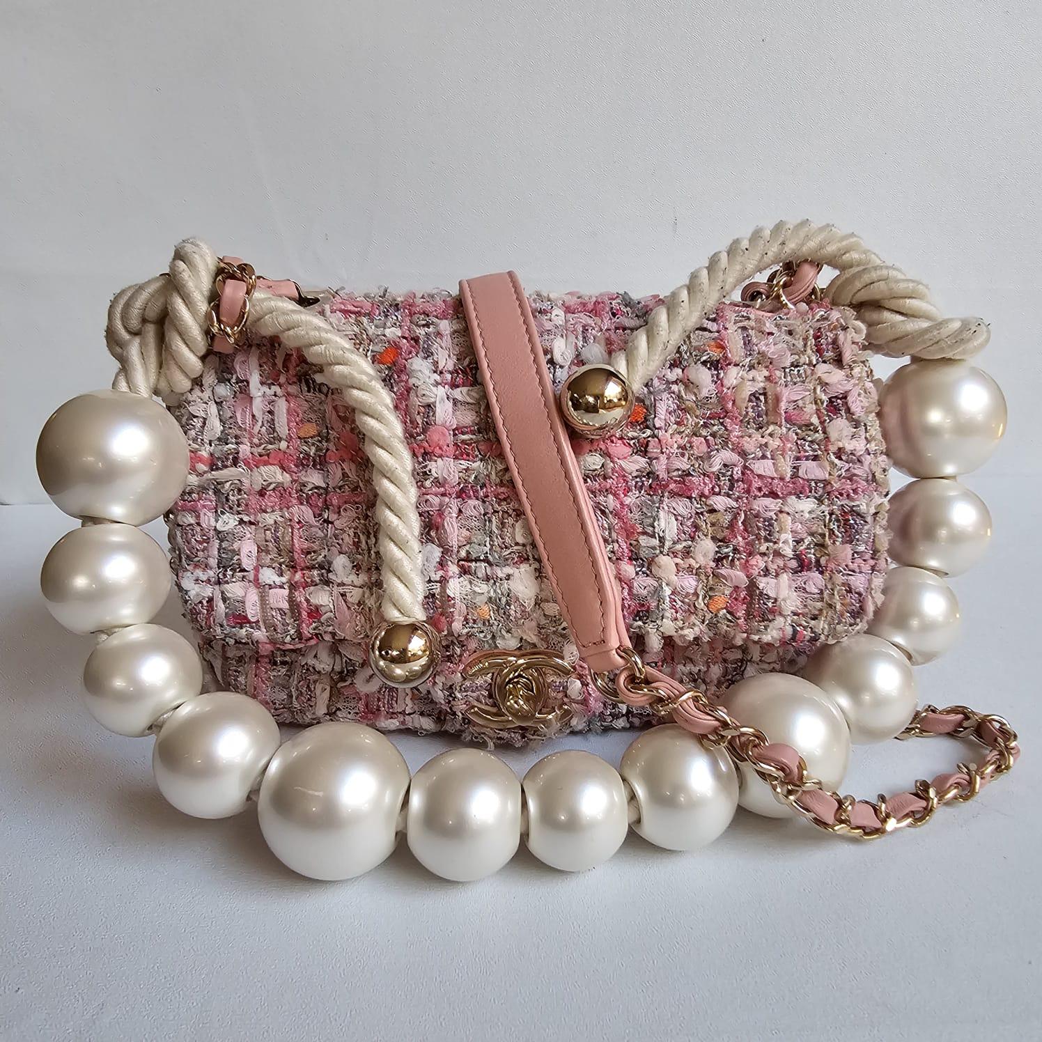 Rare by the sea in mini pink tweed. Beautiful collector bag. Classic mini flap with chunky pearl handles. Slight worn tweed, but other than that still in good condition. Item is missing its card, but clear holo and holo checker. Comes with dust bag.