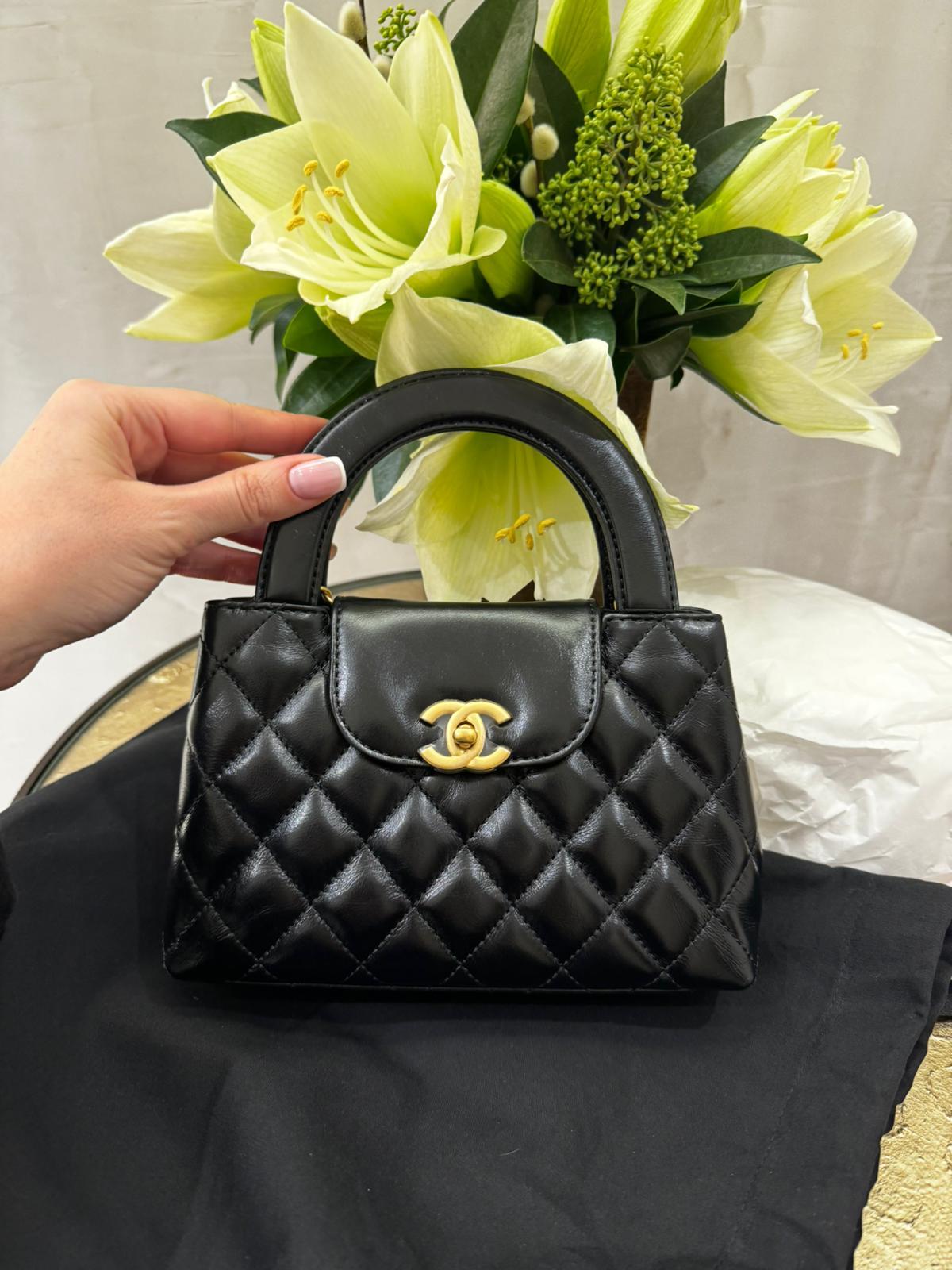 Chanel 23 MINI SHOPPING BAG black gold hardware. Very rare and popular!  Also known as the Chanel Kelly bag. This is one of the best bags made by Chanel, it looks like a mini Kelly but a more usable size. It can hold a lot of things, easily your