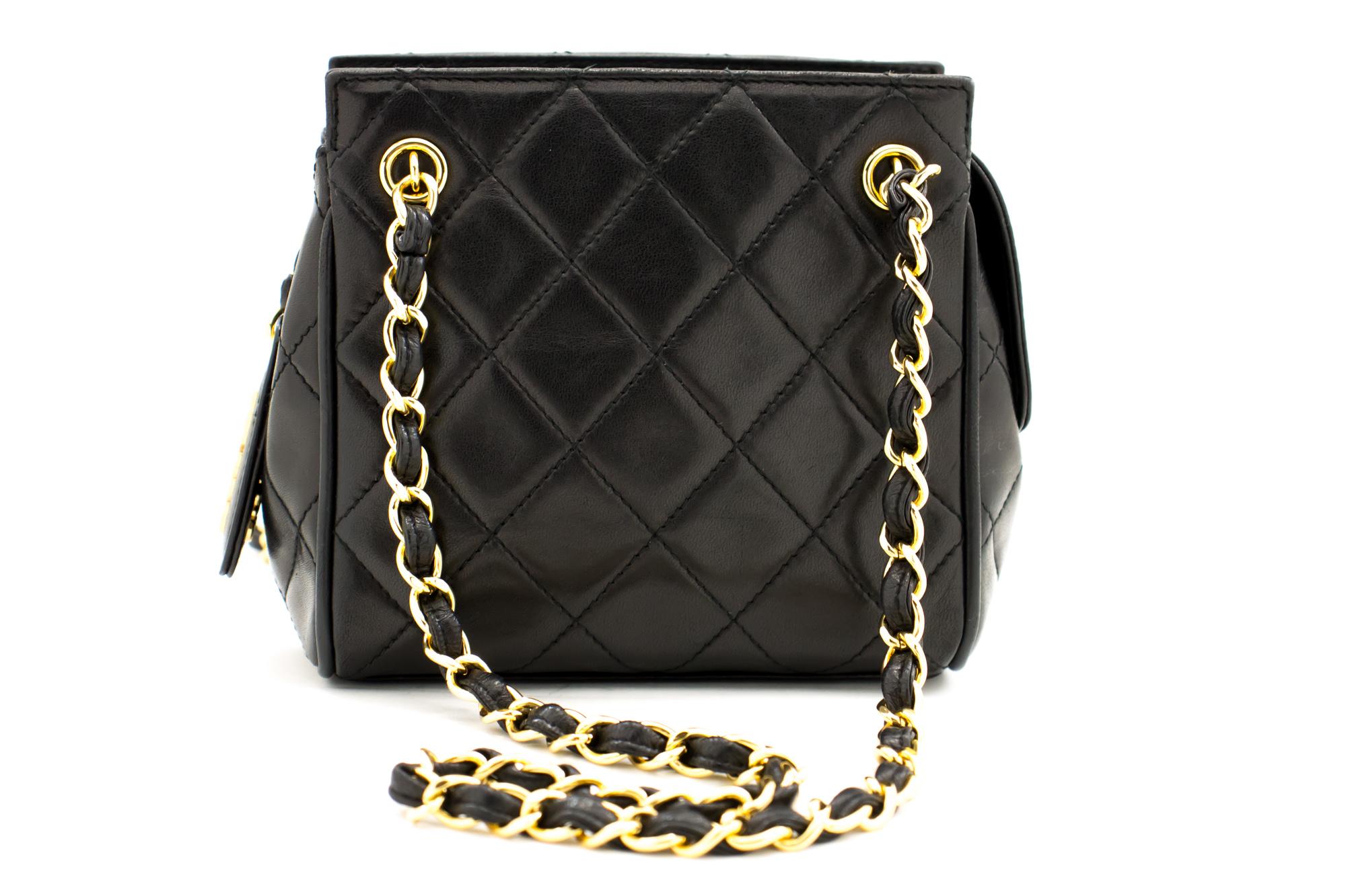 An authentic CHANEL Mini Small Double Chain Shoulder Bag Black Quilted made of black Lambskin. The color is Black. The outside material is Leather. The pattern is Solid. This item is Vintage / Classic. The year of manufacture would be