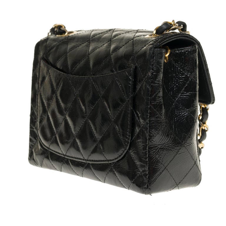 Chanel Mini square handbag in black quilted patent leather, gold